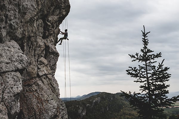 man climbing a mountain, much like the mountain of overcoming sex addiction